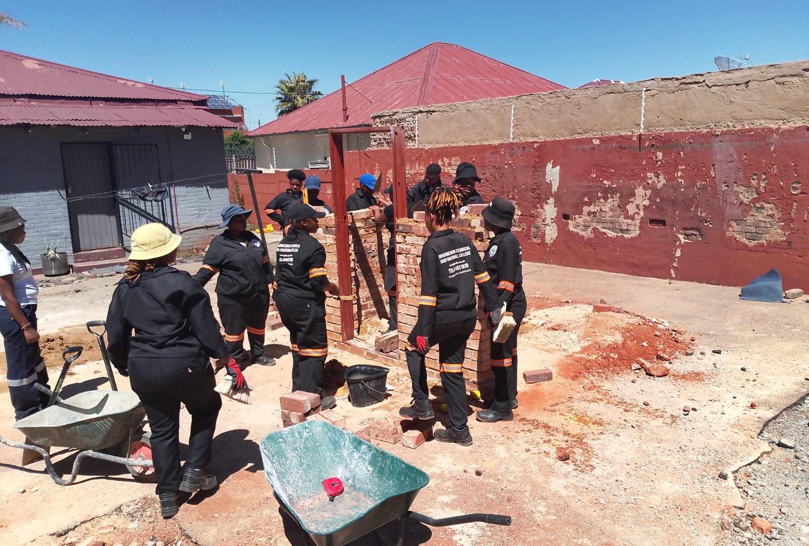 Learners working on a construction training project